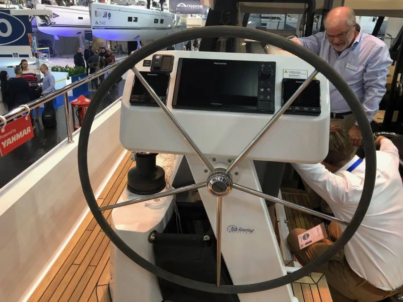 Slide: The Image of Steering wheel of 2025 Moody 41 DS yacht at a boat show. - 28