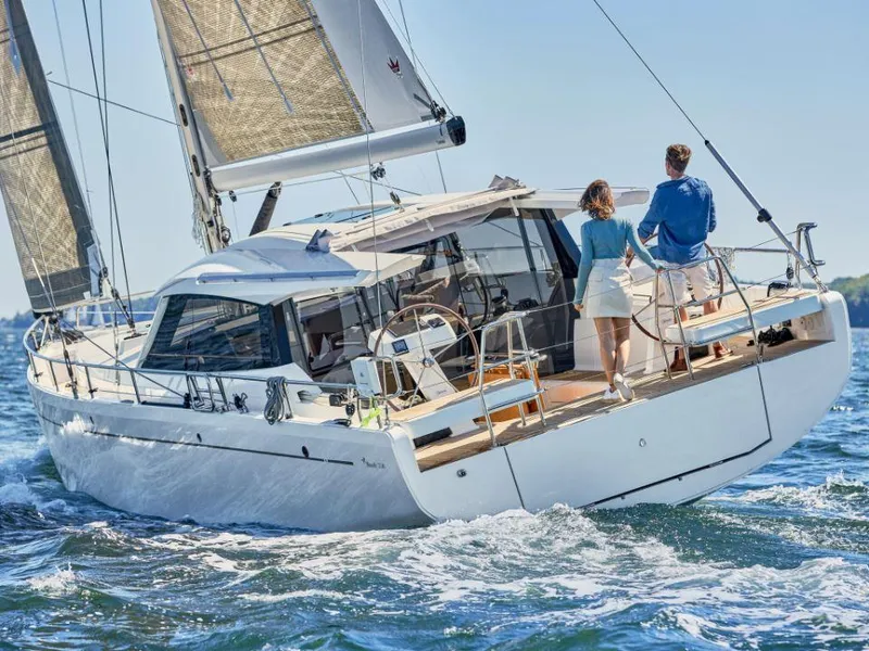 Slide: The Image of 2025 Moody 41 DS yacht sailing with two people on deck in open water. - 3