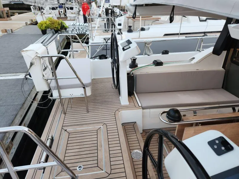 Slide: The Image of Modern 2025 Moody 41 DS yacht deck with sleek design and comfortable seating. - 30