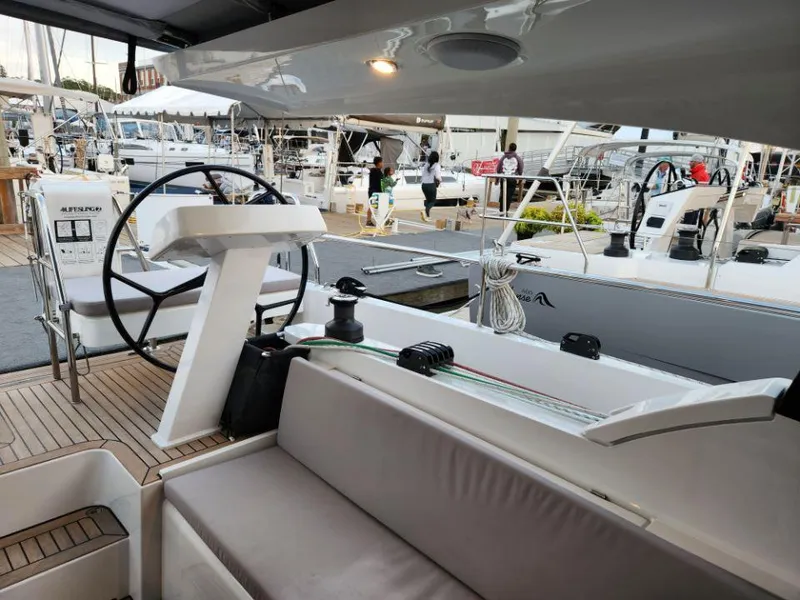 Slide: The Image of Modern 2025 Moody 41 DS yacht interior with steering wheel and seating area. - 31