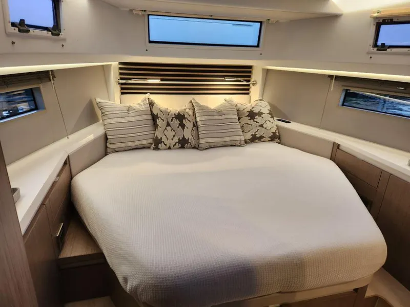 Slide: The Image of Luxurious cabin interior of 2025 Moody 41 DS yacht with cozy bedding and ambient lighting. - 35