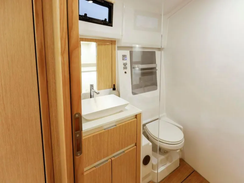 Slide: The Image of Modern bathroom interior in 2025 Moody 41 DS yacht, featuring sleek design and wooden accents. - 38