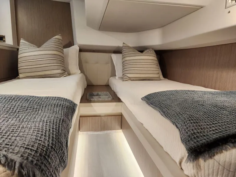Slide: The Image of Luxurious twin cabin in 2025 Moody 41 DS yacht with modern decor. - 39