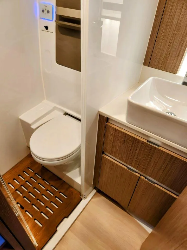 Slide: The Image of Modern bathroom in 2025 Moody 41 DS yacht with wooden accents and sleek fixtures. - 41