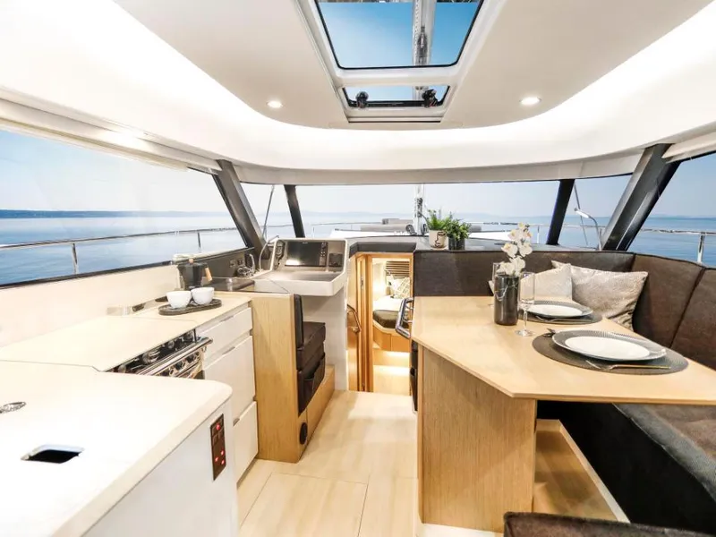 Slide: The Image of Luxurious interior of 2025 Moody 41 DS yacht with modern kitchen and dining area. - 43