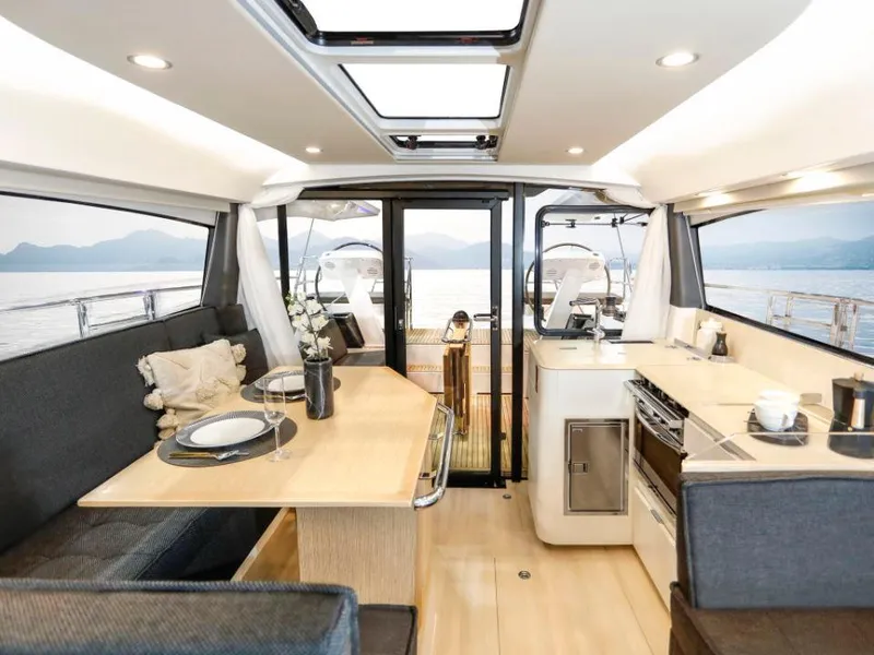 Slide: The Image of Luxurious interior of 2025 Moody 41 DS yacht with dining area and kitchen. - 44