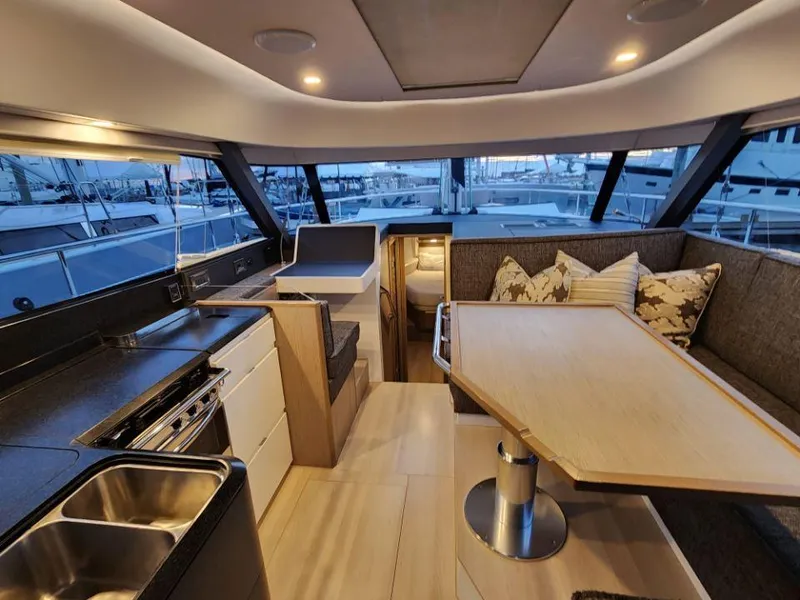 Slide: The Image of Luxurious interior of 2025 Moody 41 DS yacht with modern kitchen and dining area. - 47