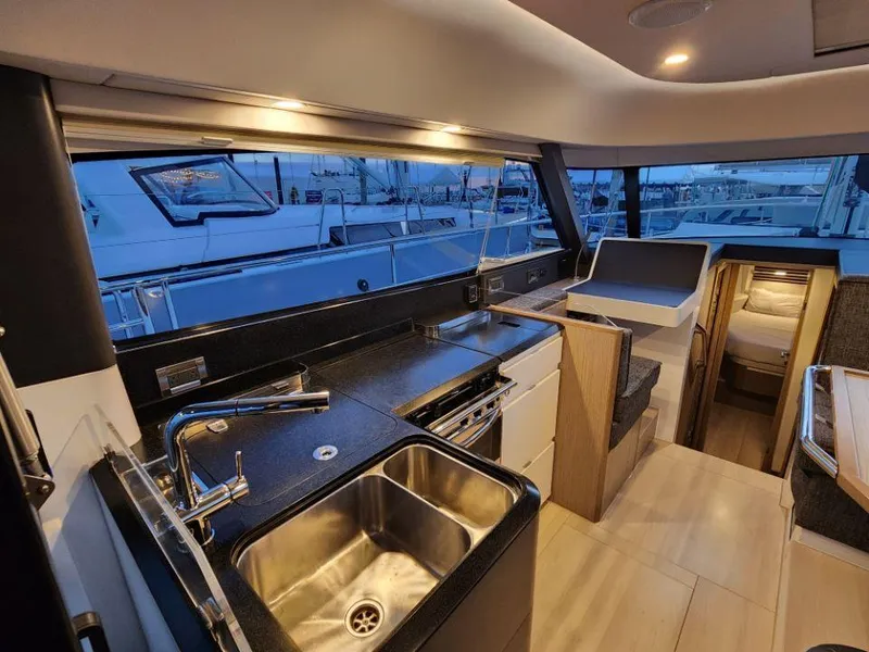 Slide: The Image of Luxurious interior of 2025 Moody 41 DS yacht with modern kitchen and cozy cabin. - 48