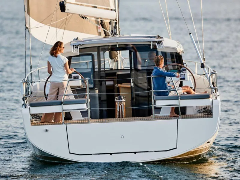 Slide: The Image of Modern 2025 Moody 41 DS sailboat with two people navigating on open water. - 5