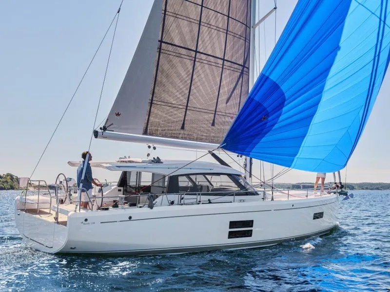 Slide: The Image of 2025 Moody 41 DS yacht sailing with blue spinnaker on open water. - 7