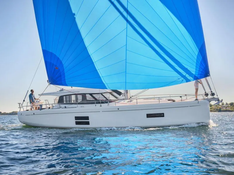 Slide: The Image of 2025 Moody 41 DS sailboat with blue sail on open water. - 8