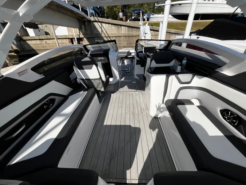 Slide: The Image of 2023 Yamaha Boats 275 SDX interior with sleek seating and modern design. - 10