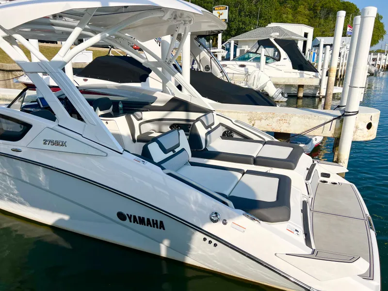 Slide: The Image of 2023 Yamaha Boats 275 SDX docked, featuring sleek design and spacious seating. - 3