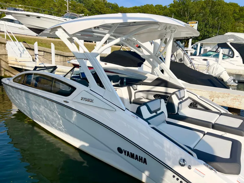 Slide: The Image of 2023 Yamaha Boats 275 SDX docked, showcasing sleek design and modern features. - 4