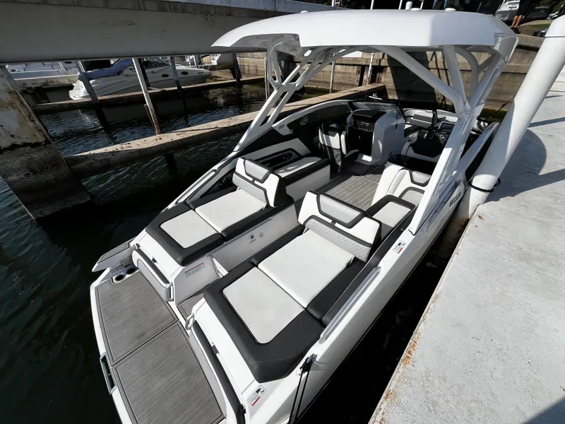 Slide: The Image of 2023 Yamaha Boats 275 SDX docked, featuring sleek design and spacious seating. - 9