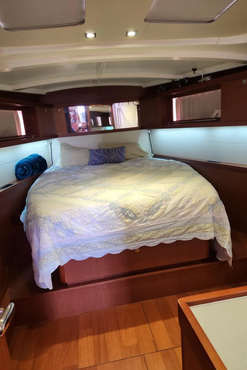 Slide: The Image of Cozy cabin interior of 2013 Beneteau Oceanis 48 yacht with a comfortable bed. - 21