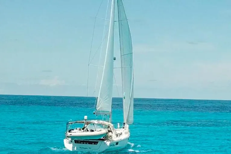 Slide: The Image of Sailing yacht Beneteau Oceanis 48, 2013 model, cruising on clear turquoise waters. - 3