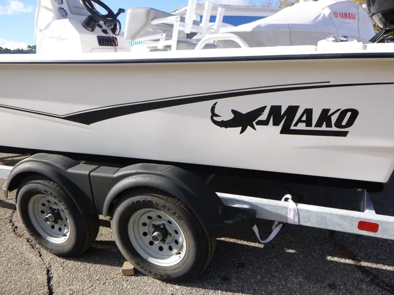 Slide: The Image of 2022 Mako 19CC boat on trailer, side view with logo. - 2