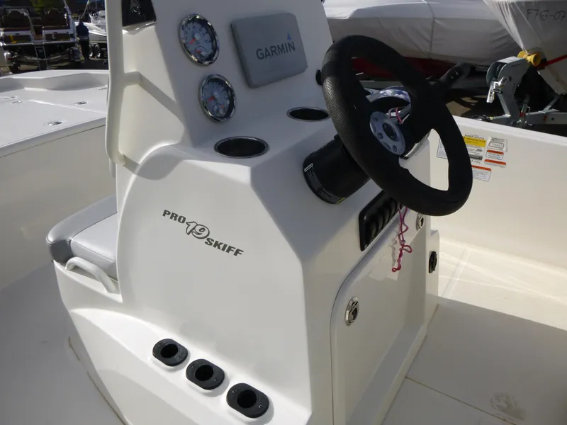 Slide: The Image of 2022 Mako 19CC boat console with Garmin navigation and Pro Skiff branding. - 24