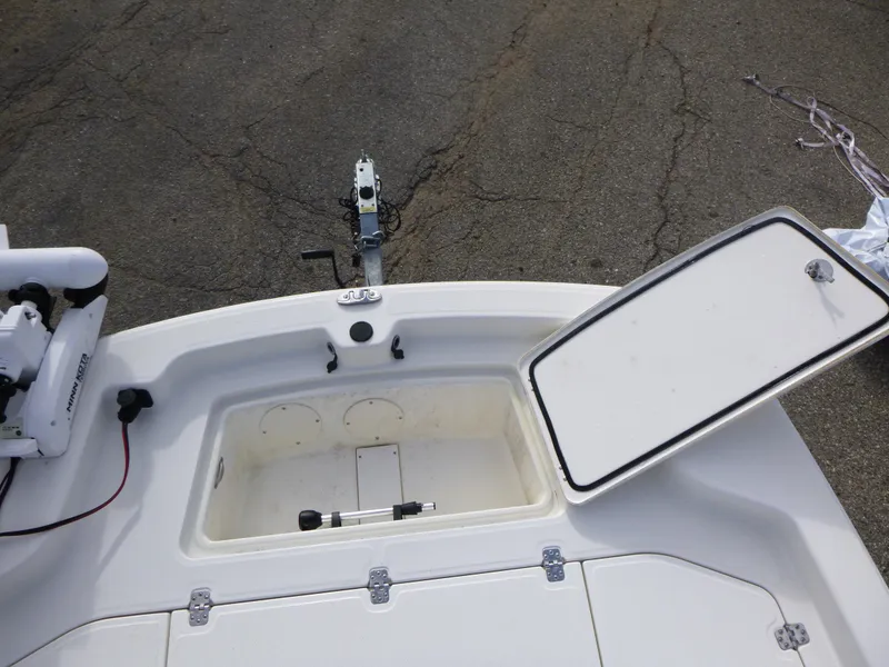 Slide: The Image of 2022 Mako 19CC boat deck with open storage compartment. - 31