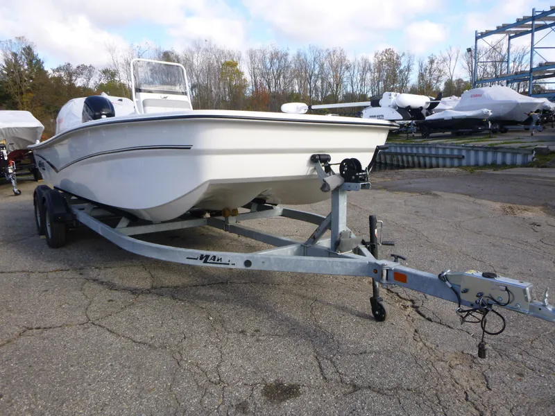 Slide: The Image of 2022 Mako 19CC boat on trailer in outdoor storage area. - 6