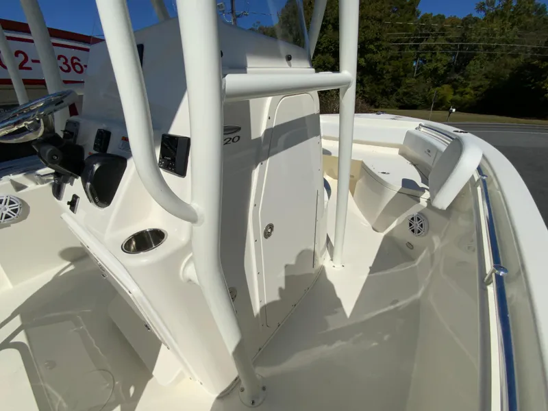 Slide: The Image of 2025 Cobia 220 Center Console boat interior with steering console and seating. - 17