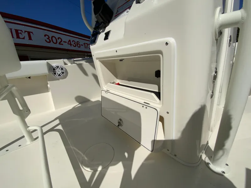 Slide: The Image of 2025 Cobia 220 Center Console boat interior storage compartment. - 25