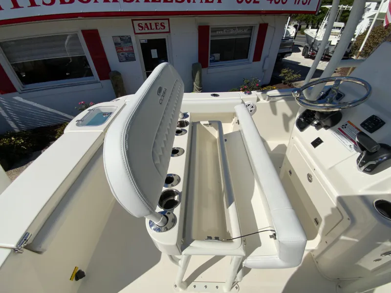 Slide: The Image of 2025 Cobia 220 Center Console boat interior with seating and control panel. - 27
