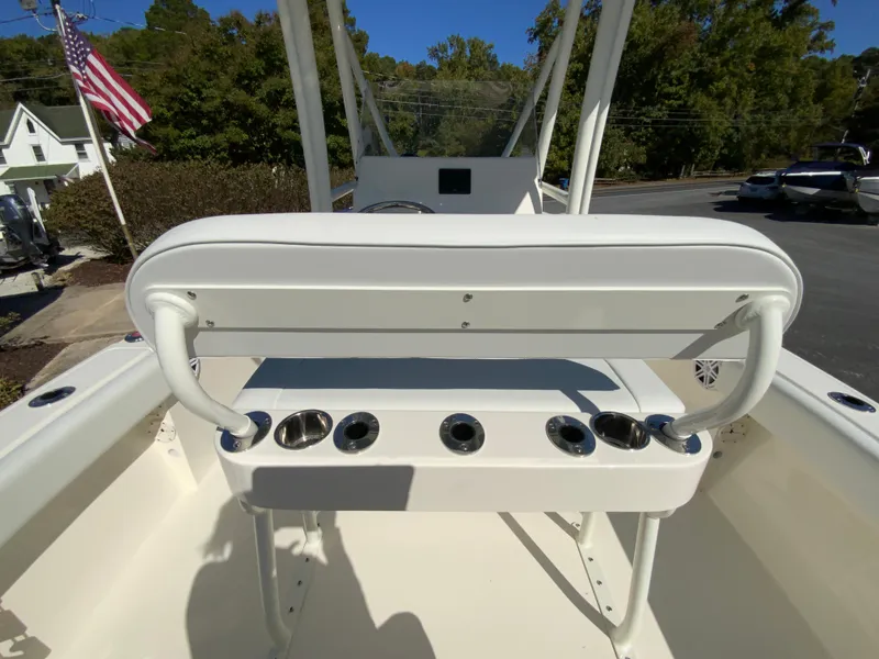 Slide: The Image of 2025 Cobia 220 Center Console boat interior with rod holders and seating. - 28