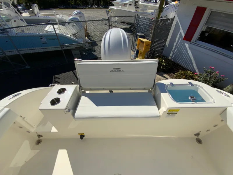 Slide: The Image of 2025 Cobia 220 Center Console boat interior with seating and storage. - 30
