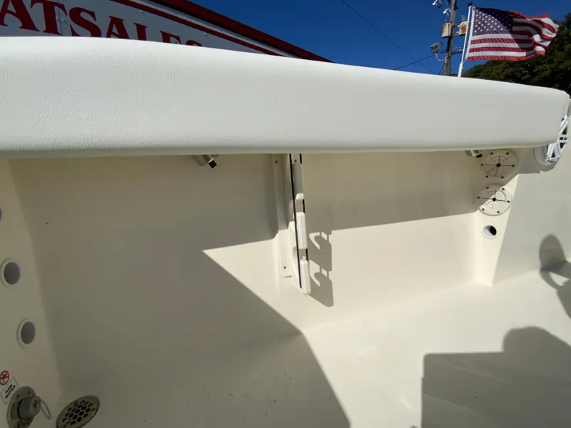 Slide: The Image of 2025 Cobia 220 Center Console boat interior with American flag in background. - 33