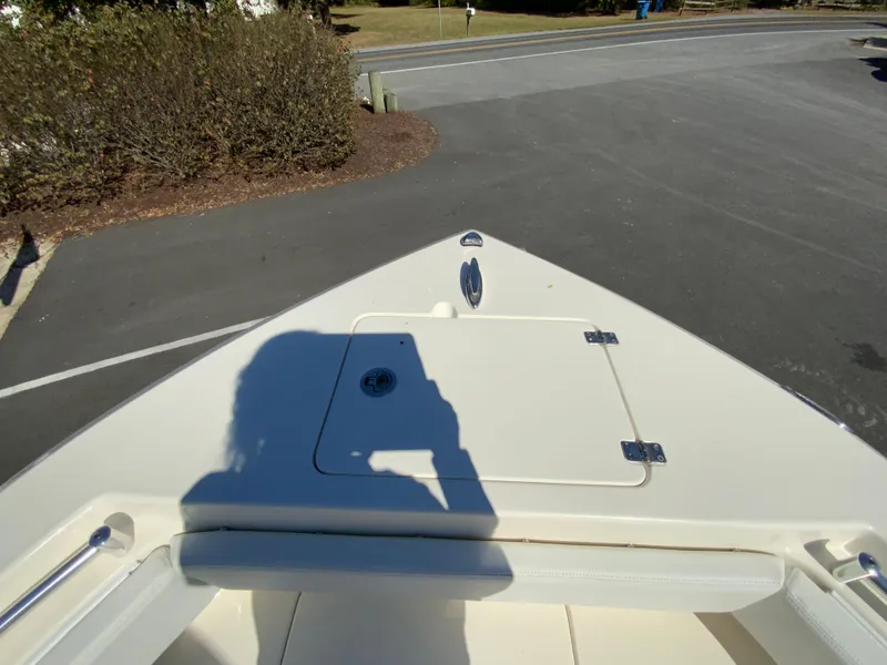 Slide: The Image of 2025 Cobia 220 Center Console boat bow with shadow on deck. - 8