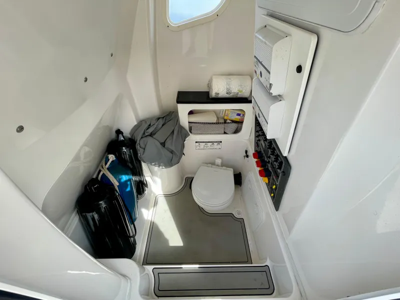 Slide: The Image of 2019 Sea Fox 288 Commander boat interior with toilet and storage compartments. - 12