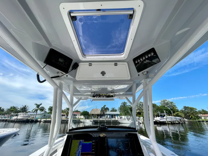 Slide: The Image of 2019 Sea Fox 288 Commander boat interior with navigation equipment and clear sky view. - 16