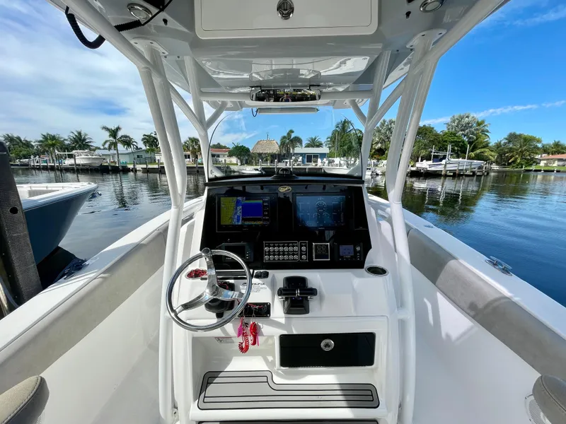Slide: The Image of 2019 Sea Fox 288 Commander boat cockpit with steering wheel and navigation equipment. - 17