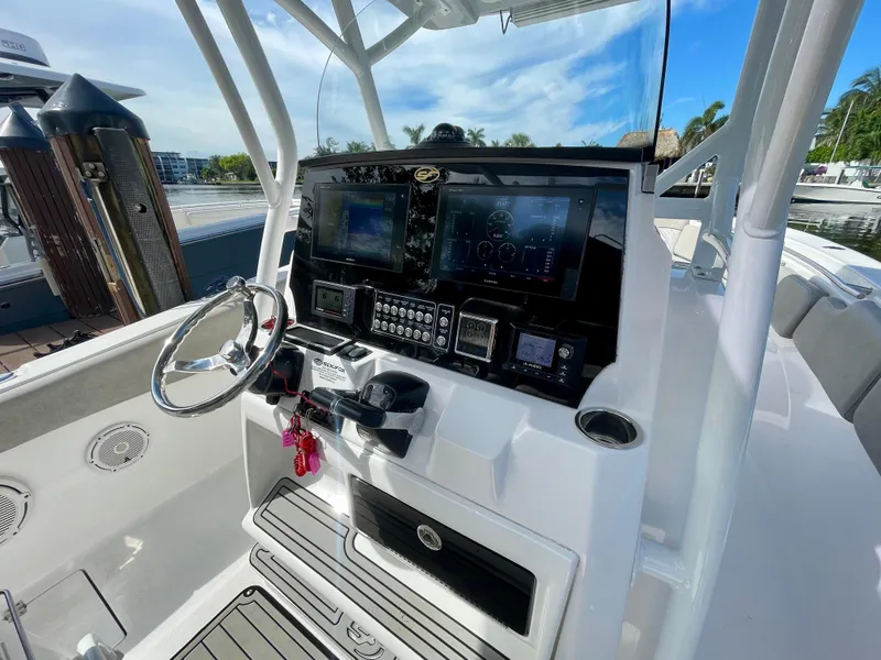 Slide: The Image of 2019 Sea Fox 288 Commander boat dashboard with modern navigation equipment and steering wheel. - 18