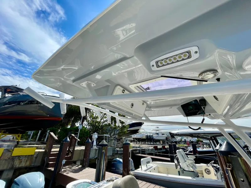 Slide: The Image of 2019 Sea Fox 288 Commander boat at dock, showcasing sleek design and modern features. - 21