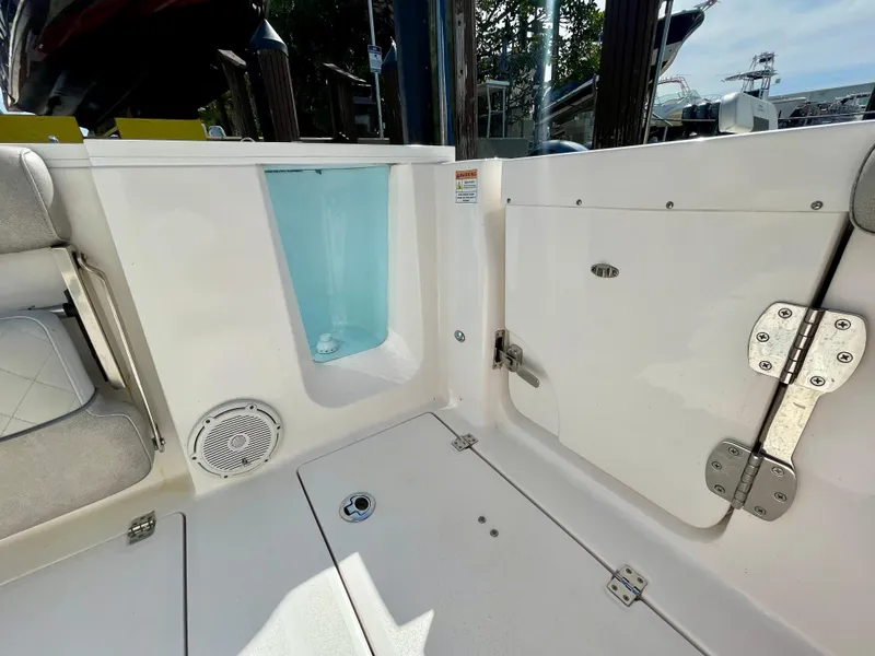 Slide: The Image of 2019 Sea Fox 288 Commander boat interior, featuring storage compartments and seating area. - 26