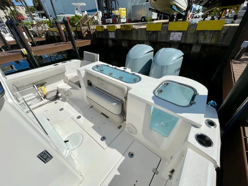 Slide: The Image of 2019 Sea Fox 288 Commander boat interior with dual engines at dock. - 27