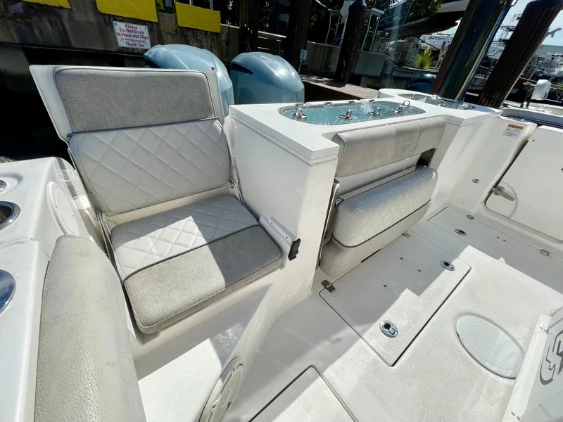 Slide: The Image of 2019 Sea Fox 288 Commander boat interior with cushioned seating and storage compartments. - 29