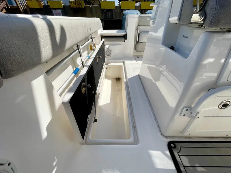 Slide: The Image of 2019 Sea Fox 288 Commander boat interior with storage compartments and seating. - 35