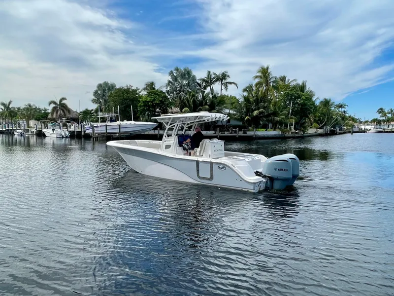 Slide: The Image of 2019 Sea Fox 288 Commander boat cruising on a calm, scenic waterway. - 40