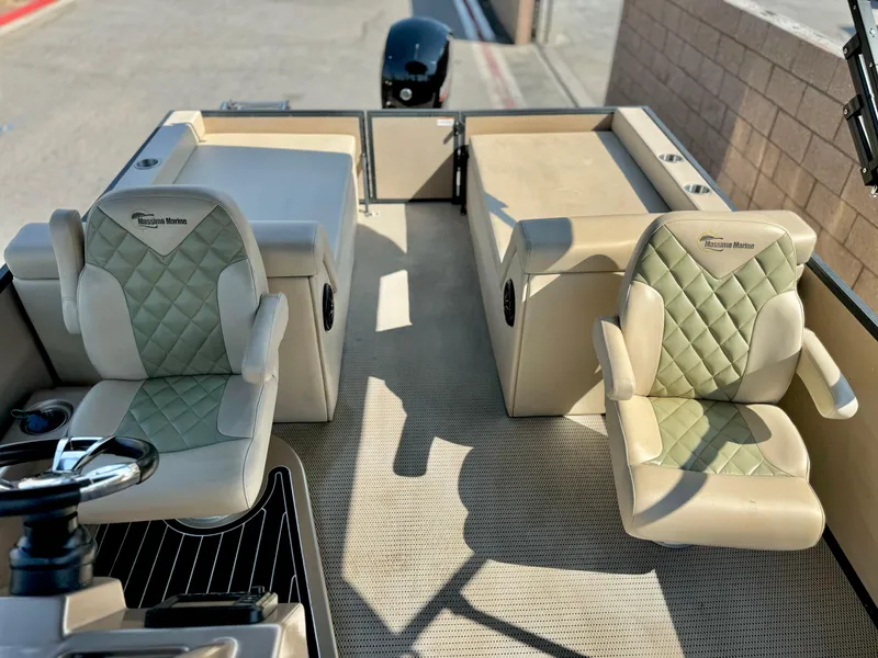 Slide: The Image of 2023 Massimo Marine P23 MAX boat interior with beige quilted seats. - 11
