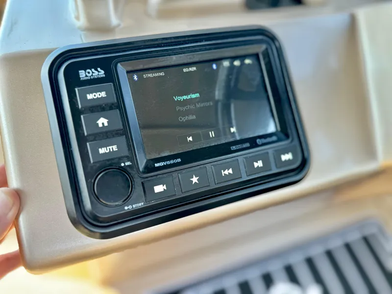 Slide: The Image of Boat stereo system on Massimo Marine P23 MAX, 2023 model, displaying music track. - 16