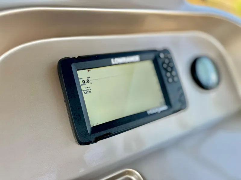 Slide: The Image of Close-up of a 2023 Massimo Marine P23 MAX dashboard with a Lowrance display. - 17