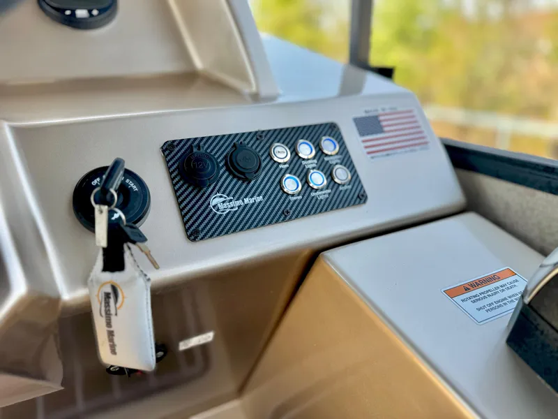 Slide: The Image of Dashboard of 2023 Massimo Marine P23 MAX boat with control panel and American flag decal. - 18