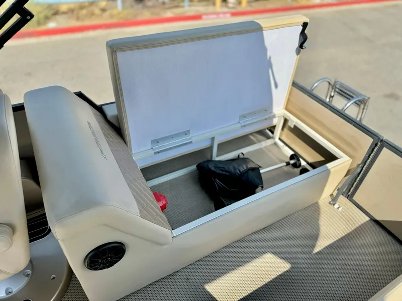 Slide: The Image of Massimo Marine P23 MAX 2023 boat storage compartment open, revealing interior space. - 21