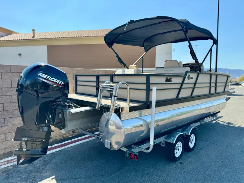 Slide: The Image of 2023 Massimo Marine P23 MAX pontoon boat with Mercury engine on trailer. - 5
