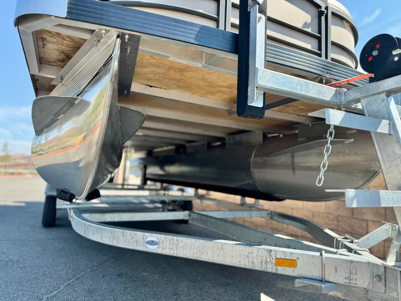 Slide: The Image of 2023 Massimo Marine P23 MAX pontoon boat on trailer, close-up view. - 7