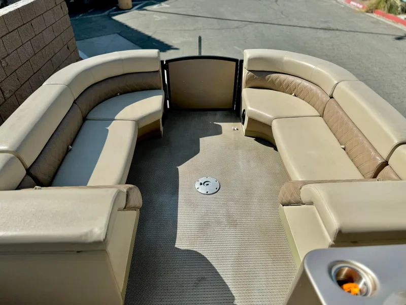 Slide: The Image of Massimo Marine P23 MAX 2023 boat interior with beige seating and spacious layout. - 8